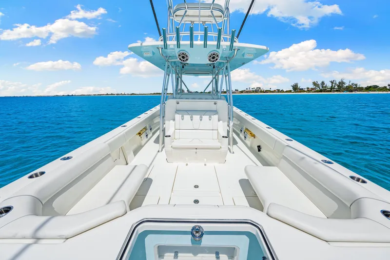 Slide: The Image of 2021 SeaVee 390B boat on clear blue water under a bright sky. - 30