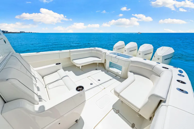Slide: The Image of Luxurious 2021 SeaVee 390B boat interior with white seating and ocean view. - 32