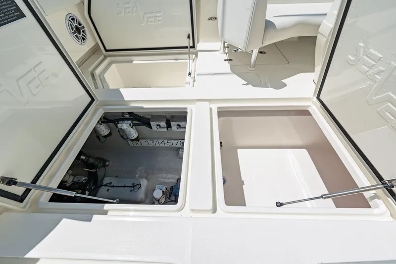 Slide: The Image of 2021 SeaVee 390B boat storage compartments open, showcasing interior details and equipment. - 37