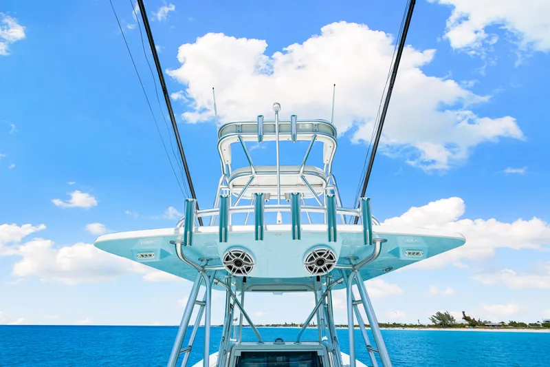 Slide: The Image of 2021 SeaVee 390B boat against a bright blue sky and ocean backdrop. - 39