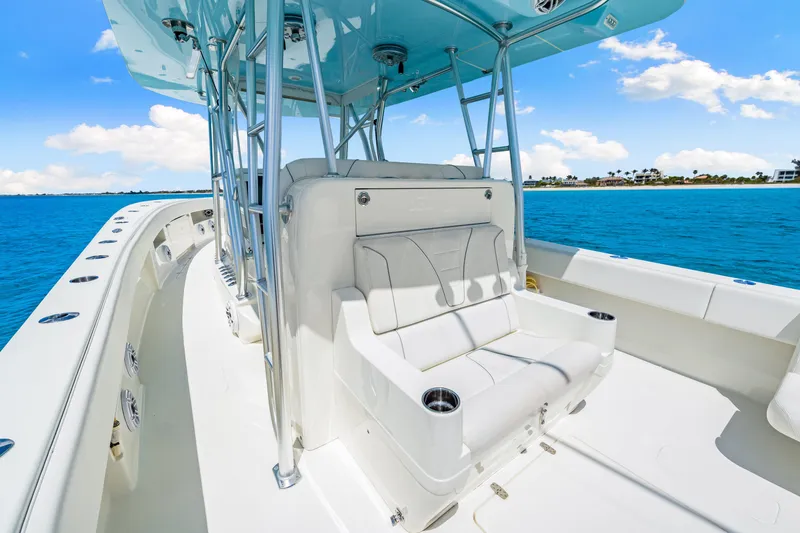 Slide: The Image of 2021 SeaVee 390B boat interior with white seating, ocean view, and blue sky. - 40