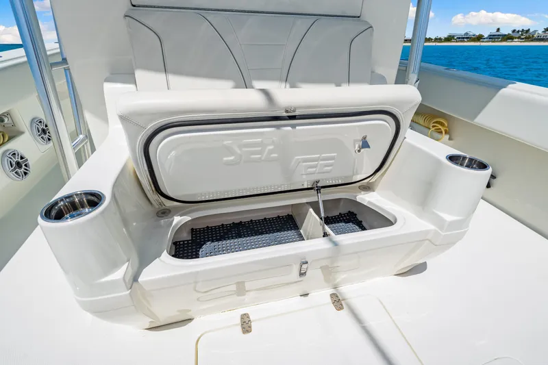 Slide: The Image of 2021 SeaVee 390B boat with open storage compartment and cup holders on deck. - 41