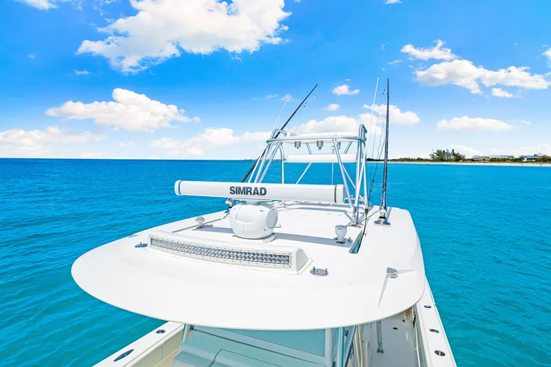 Slide: The Image of 2021 SeaVee 390B boat on clear blue ocean under sunny sky. - 48