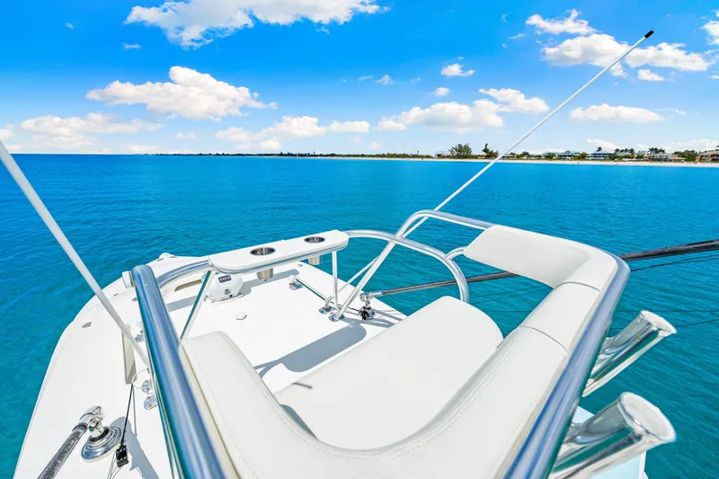 Slide: The Image of 2021 SeaVee 390B boat on clear blue ocean under a bright sky. - 50