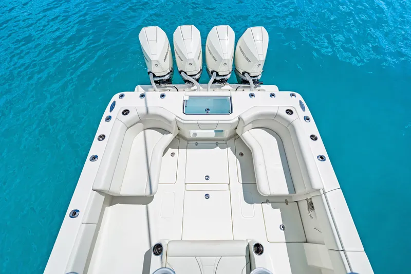 Slide: The Image of 2021 SeaVee 390B boat with quad engines on clear blue water. - 53