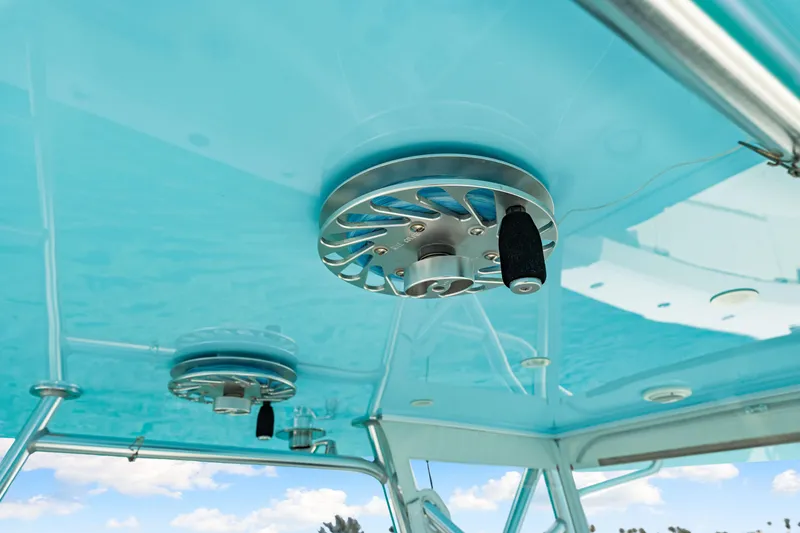 Slide: The Image of 2021 SeaVee 390B boat with blue canopy and stainless steel fittings. - 56