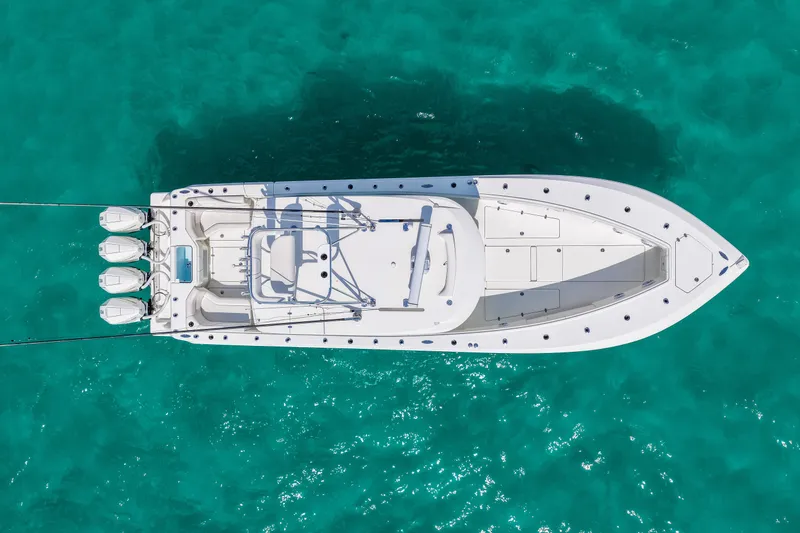 Slide: The Image of Aerial view of 2021 SeaVee 390B boat on clear turquoise water. - 6