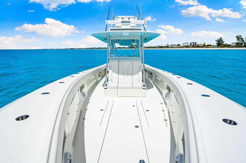 Slide: The Image of 2021 SeaVee 390B boat on clear blue water under a sunny sky. - 60