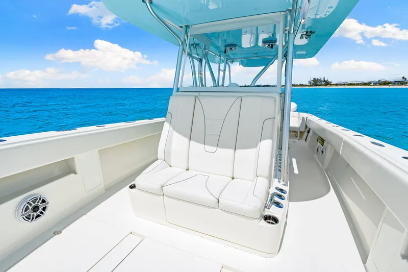 Slide: The Image of 2021 SeaVee 390B boat interior with white seating, ocean view, and blue sky. - 61