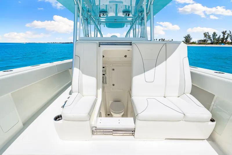 Slide: The Image of 2021 SeaVee 390B boat interior with white seating and ocean view. - 62