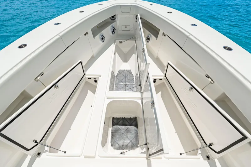 Slide: The Image of 2021 SeaVee 390B boat deck with open storage compartments, showcasing spacious design. - 65
