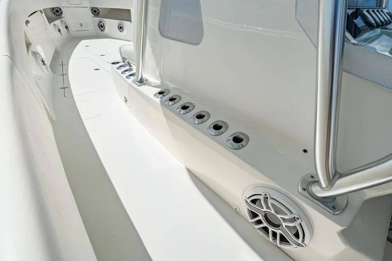 Slide: The Image of 2021 SeaVee 390B boat interior with rod holders and speakers, showcasing sleek design. - 68