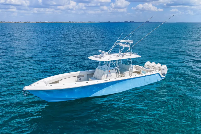 Slide: The Image of 2021 SeaVee 390B boat on clear blue ocean water under a partly cloudy sky. - 9