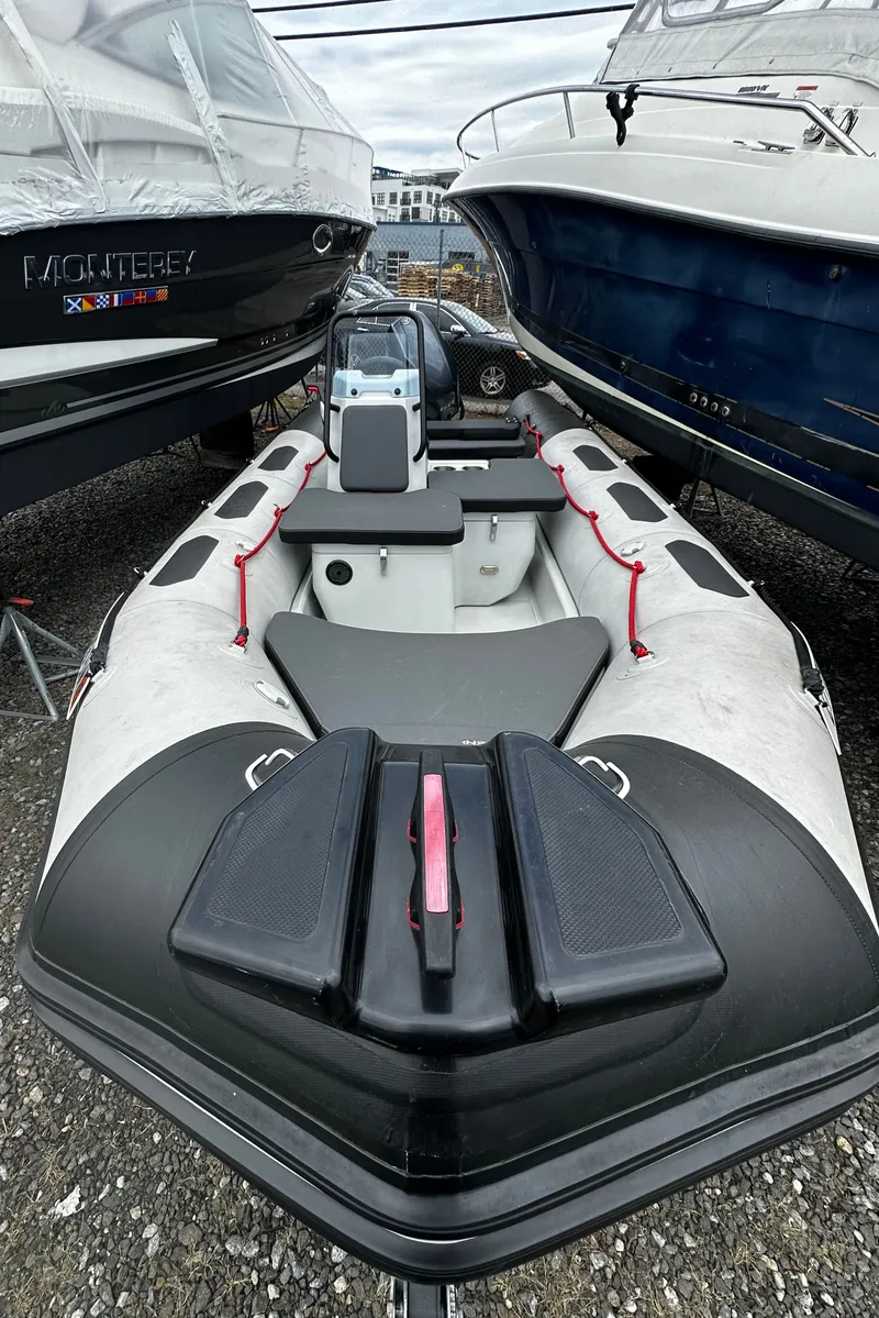Slide: The Image of 2023 Zodiac Open 4.8 inflatable boat in a boatyard. - 4