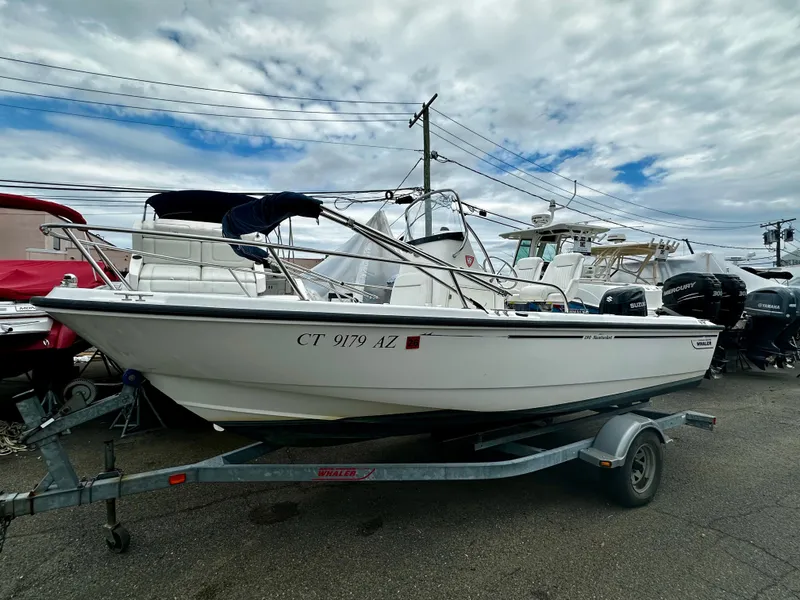 The Image of 2004 Boston Whaler 190 Nantucket boat on trailer, side view. - 1