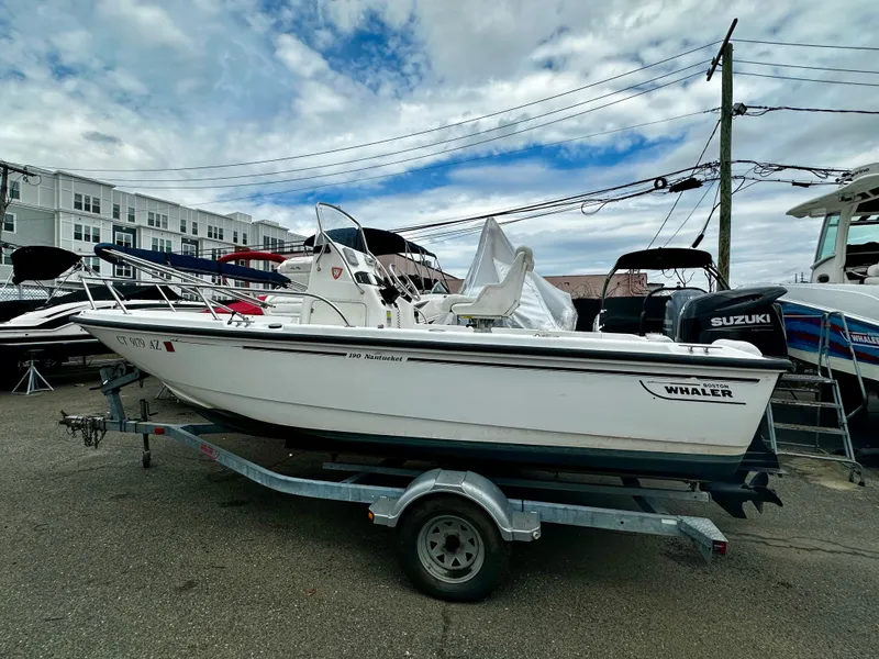 Slide: The Image of 2004 Boston Whaler 190 Nantucket on trailer, parked outdoors. - 12