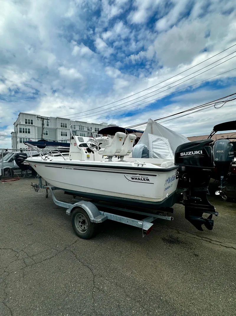 Slide: The Image of 2004 Boston Whaler 190 Nantucket boat on trailer, Suzuki engine. - 13