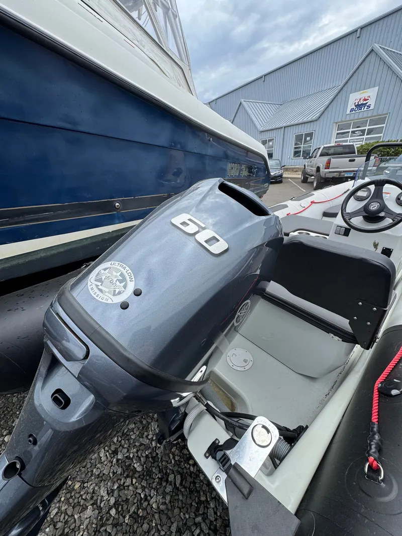 Slide: The Image of Outboard motor of a 2004 Boston Whaler 190 Nantucket. - 15