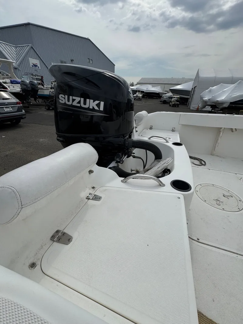 Slide: The Image of 2004 Boston Whaler 190 Nantucket with Suzuki engine at dock. - 16