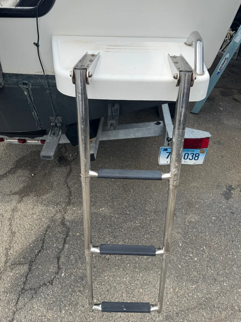 Slide: The Image of 2004 Boston Whaler 190 Nantucket with retractable swim ladder. - 18