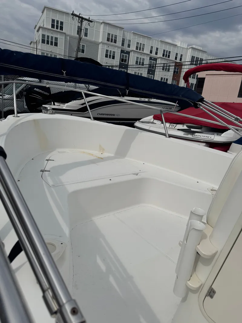 Slide: The Image of 2004 Boston Whaler 190 Nantucket boat in harbor, white interior. - 27
