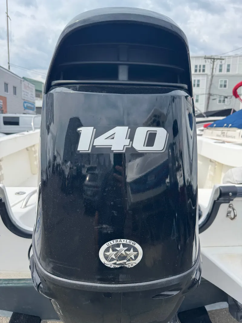 Slide: The Image of Outboard motor of a 2004 Boston Whaler 190 Nantucket boat. - 29