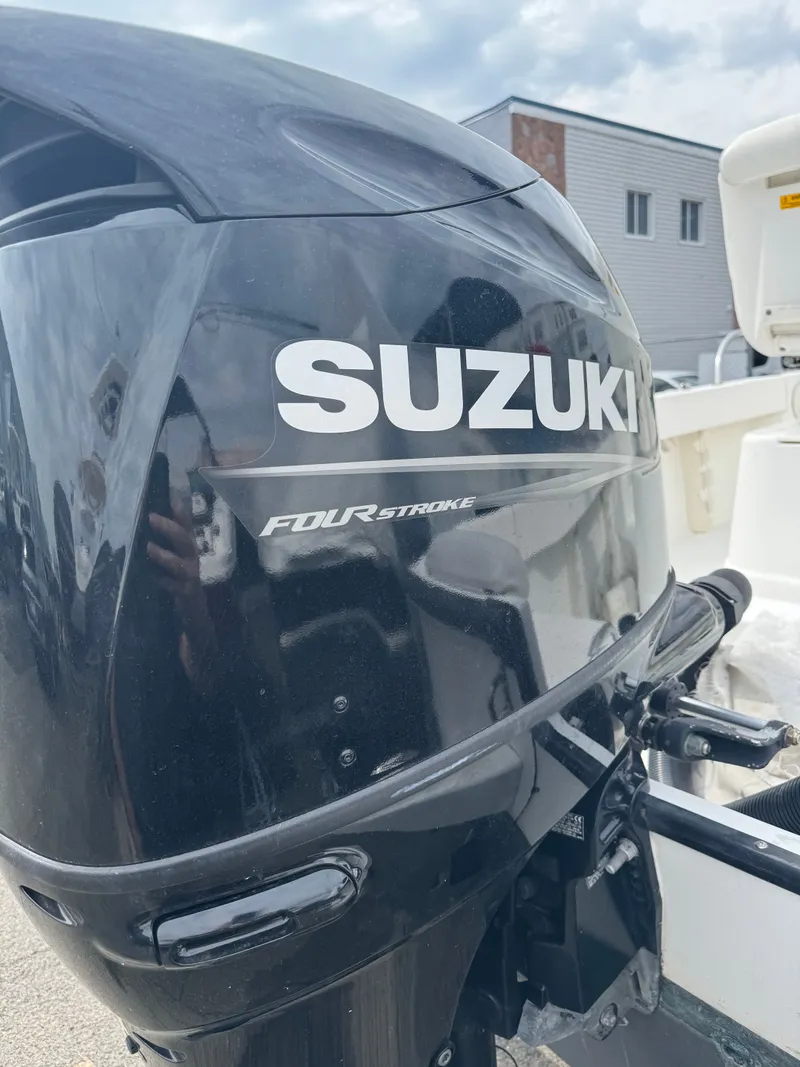 Slide: The Image of Suzuki Four Stroke outboard motor on 2004 Boston Whaler 190 Nantucket. - 30