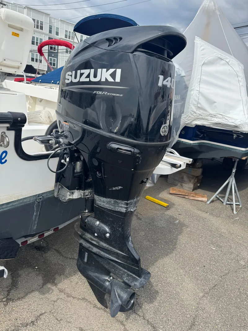 Slide: The Image of Suzuki 140 HP outboard motor on a 2004 Boston Whaler 190 Nantucket. - 33