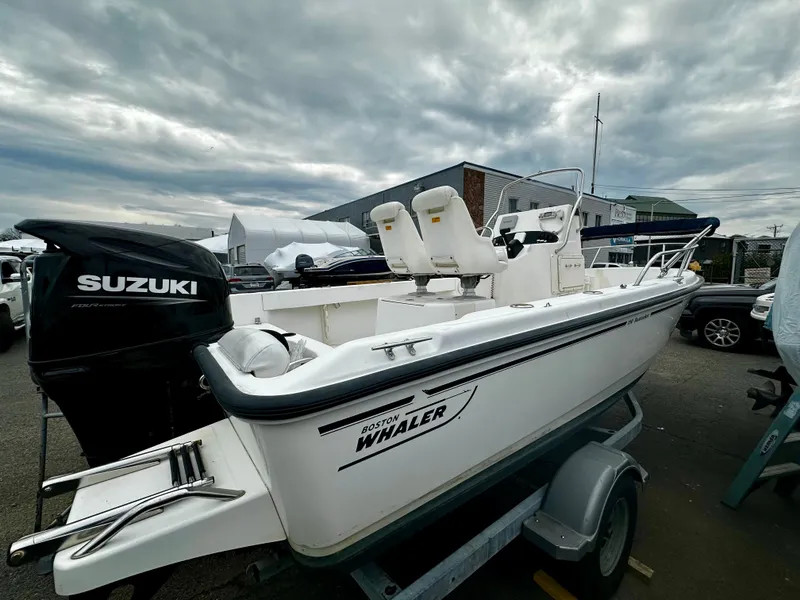 Slide: The Image of 2004 Boston Whaler 190 Nantucket boat with Suzuki engine. - 36