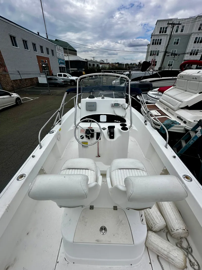 Slide: The Image of 2004 Boston Whaler 190 Nantucket boat docked at marina. - 8
