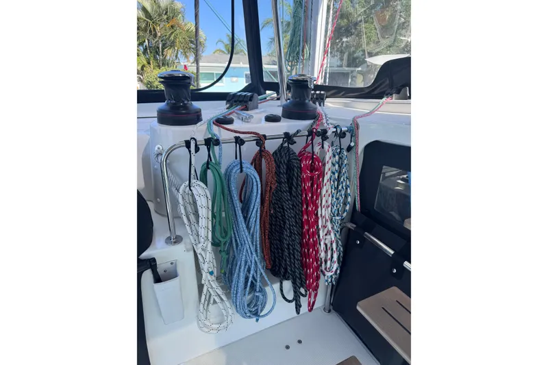 Slide: The Image of Colorful ropes and winches on a 2018 Lagoon 42 catamaran deck. - 17