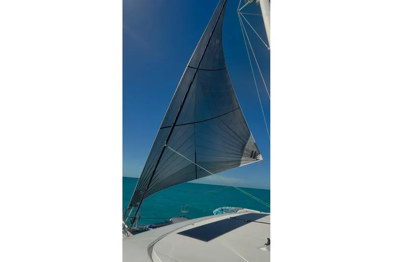 Slide: The Image of Sailing on a 2018 Lagoon 42 catamaran with a clear blue sky and ocean. - 3