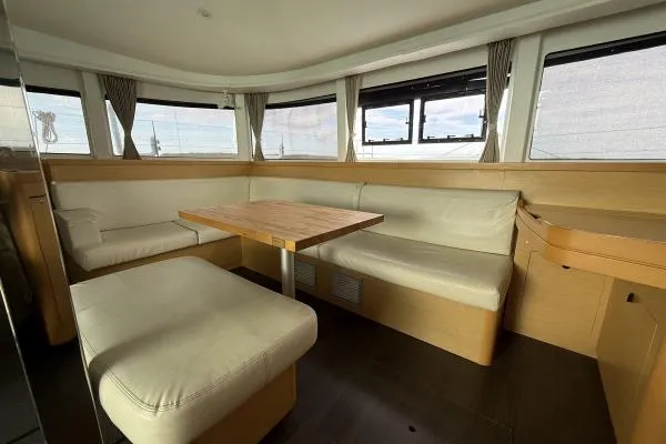 Slide: The Image of Luxurious interior of 2018 Lagoon 42 catamaran with spacious seating and panoramic windows. - 4