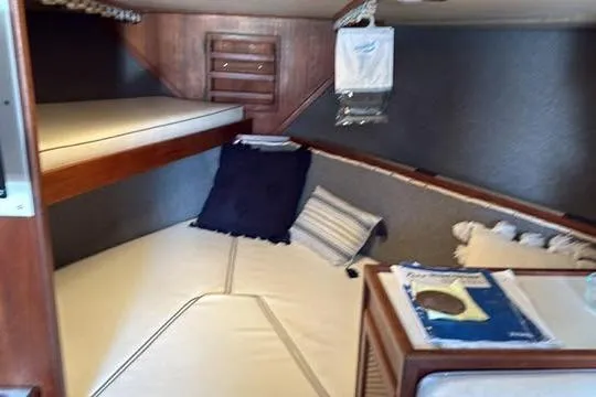 Slide: The Image of Interior cabin of 1986 Topaz 32 Express boat with cozy sleeping area. - 11