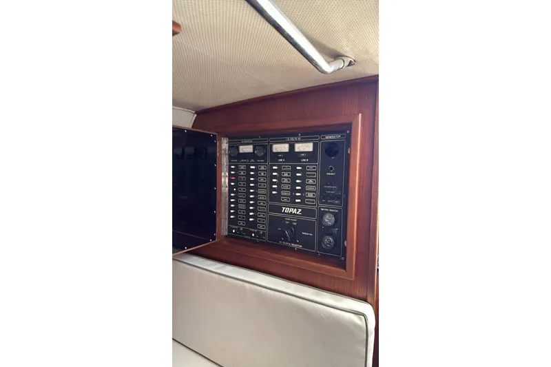 Slide: The Image of Electrical panel of a 1986 Topaz 32 Express boat, featuring control switches and gauges. - 6