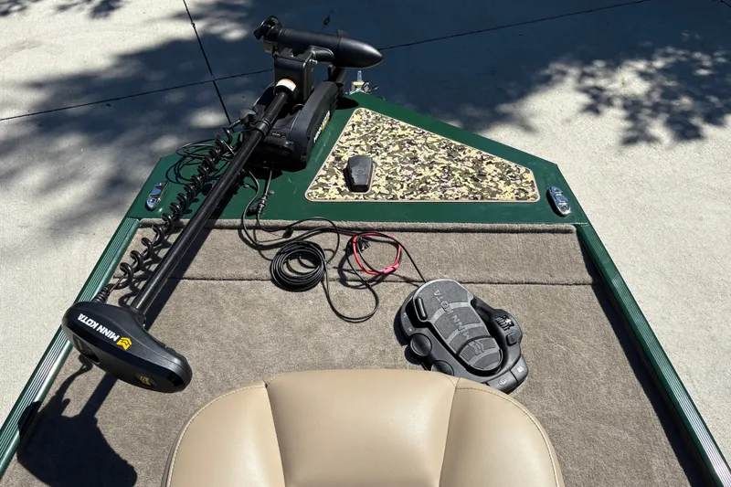 Slide: The Image of 2026 Tracker Bass Tracker Classic Limited boat deck with Minn Kota trolling motor and controls. - 13