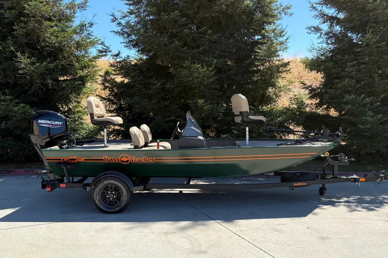 The Image of 2026 Tracker Bass Tracker Classic Limited boat on trailer, parked outdoors. - 0