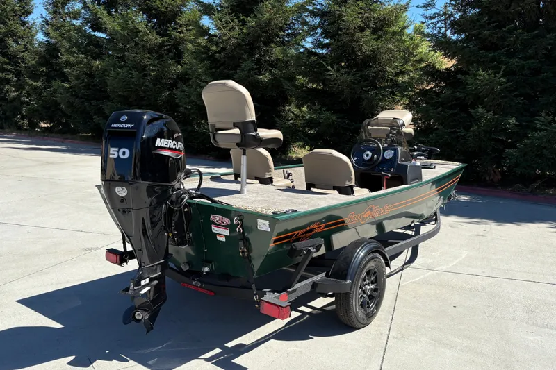 Slide: The Image of 2026 Tracker Bass Tracker Classic Limited boat with Mercury 50 engine on trailer. - 3