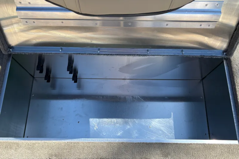 Slide: The Image of Open storage compartment in 2026 Tracker Bass Tracker Classic Limited boat. - 29