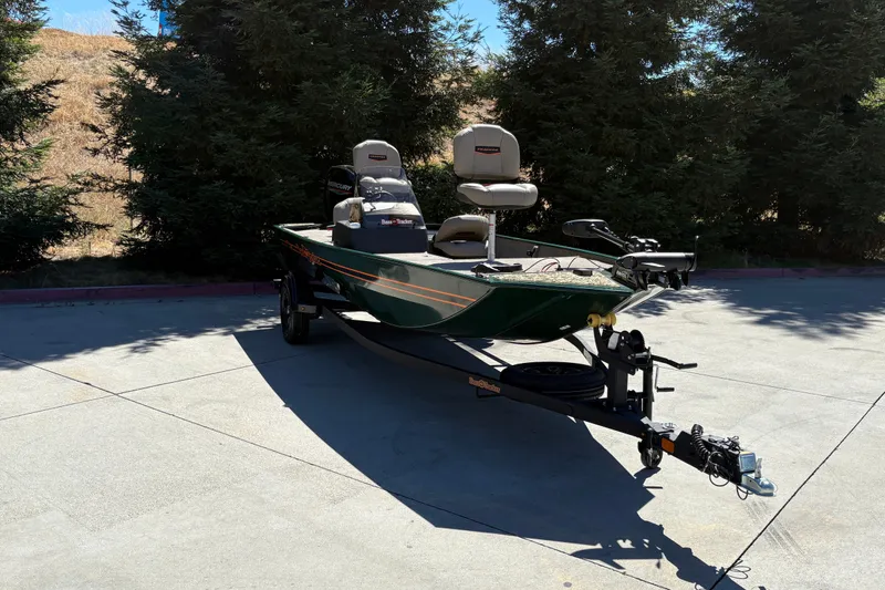 Slide: The Image of 2026 Tracker Bass Tracker Classic Limited boat on trailer, parked outdoors. - 7