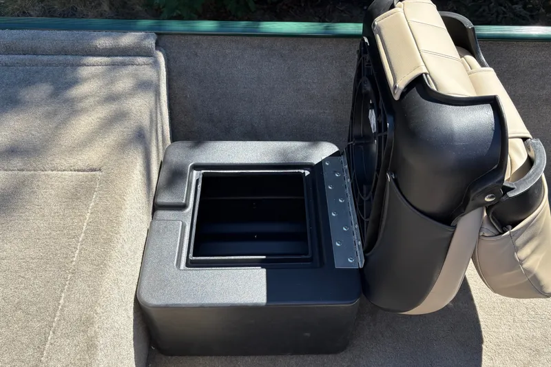 Slide: The Image of 2026 Tracker Bass Tracker Classic Limited boat seat with storage compartment open. - 25