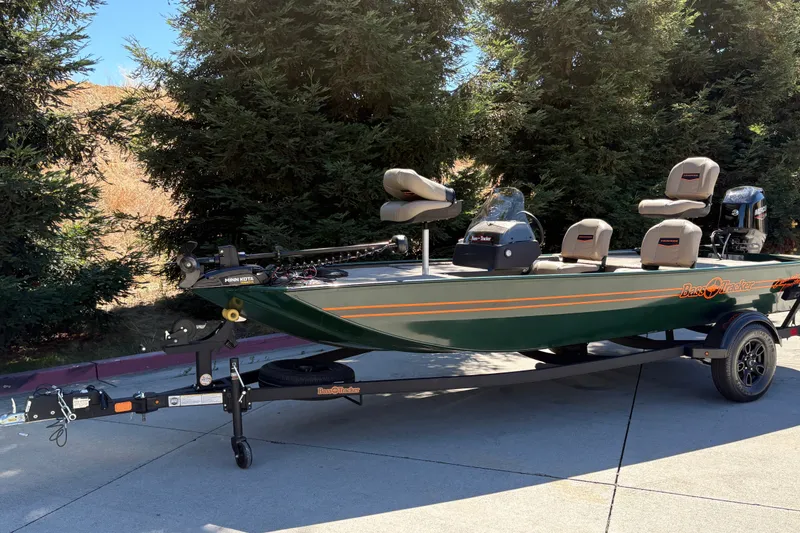 Slide: The Image of 2026 Tracker Bass Tracker Classic Limited boat on trailer, parked outdoors. - 4