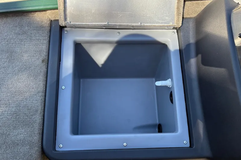 Slide: The Image of Open storage compartment in 2026 Tracker Bass Tracker Classic Limited boat. - 28