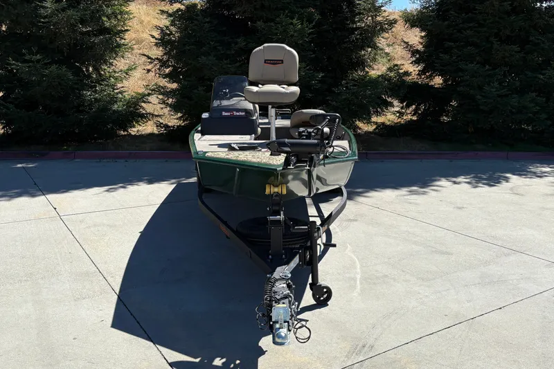 Slide: The Image of 2026 Tracker Bass Tracker Classic Limited boat on trailer, parked outdoors. - 8