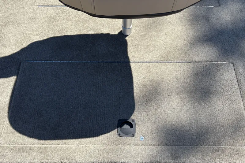 Slide: The Image of Carpeted deck of 2026 Tracker Bass Tracker Classic Limited boat, featuring a seat base. - 21