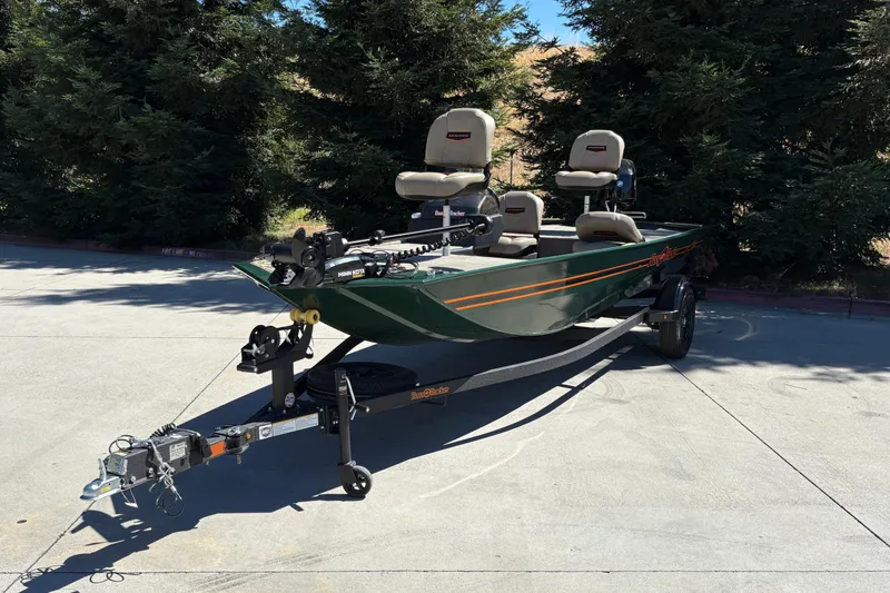 Slide: The Image of 2026 Tracker Bass Tracker Classic Limited boat on trailer, parked outdoors. - 5