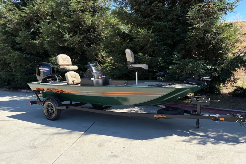 Slide: The Image of 2026 Tracker Bass Tracker Classic Limited boat on trailer, parked outdoors. - 6