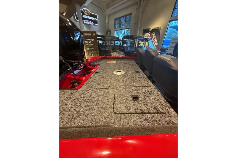 Slide: The Image of 2026 Tracker Pro Team 175 Crappie Edition boat interior with carpeted deck and seating. - 8