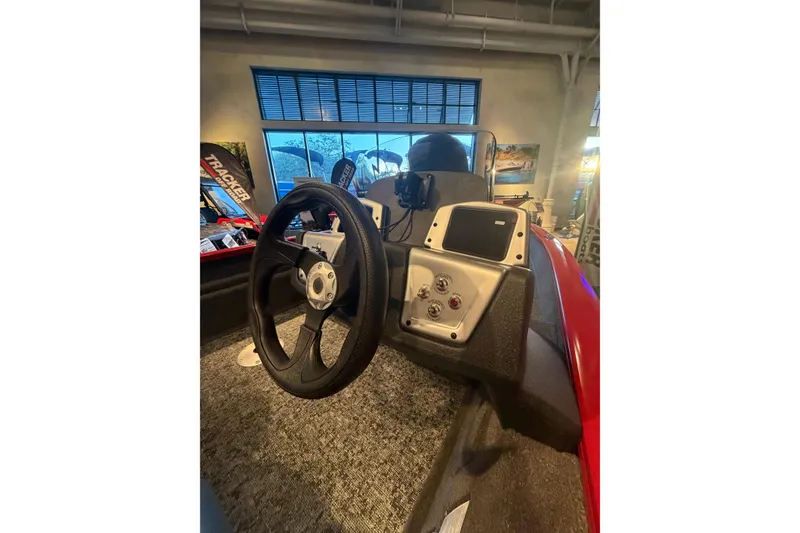 Slide: The Image of 2026 Tracker Pro Team 175 Crappie Edition boat interior with steering wheel and control panel. - 5