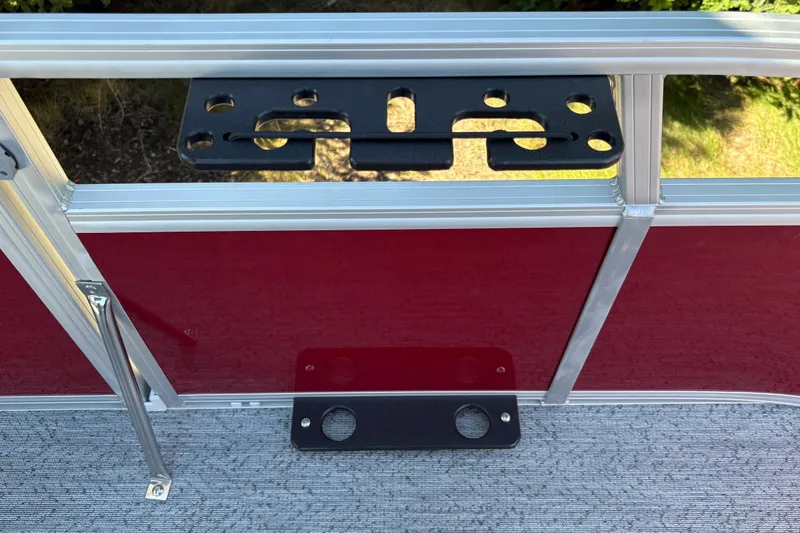 Slide: The Image of 2026 Sun Tracker Bass Buggy 16 XL Select boat railing with mounted accessory bracket. - 28